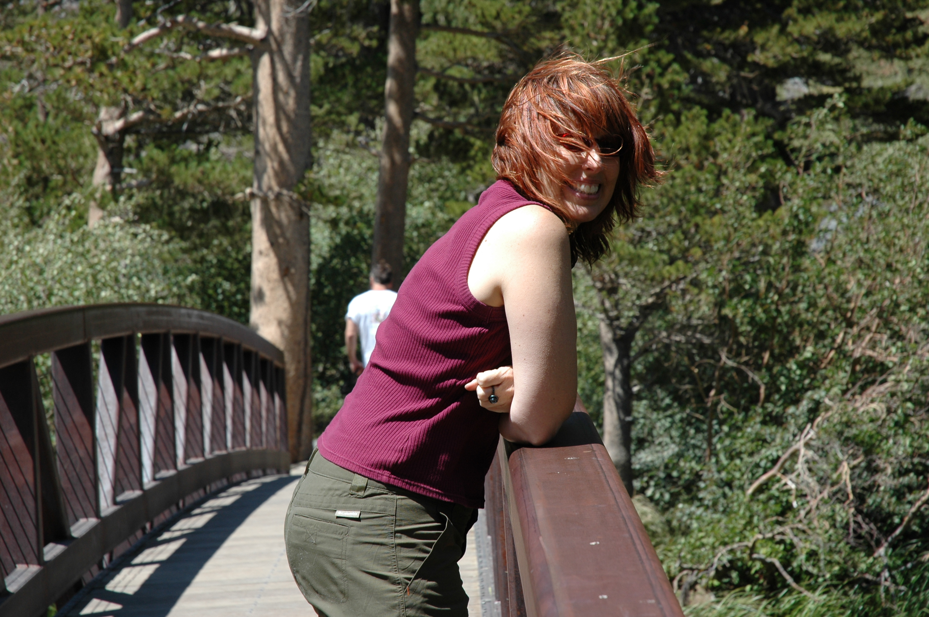 Leee Hockenberry leaning on a bridge railing