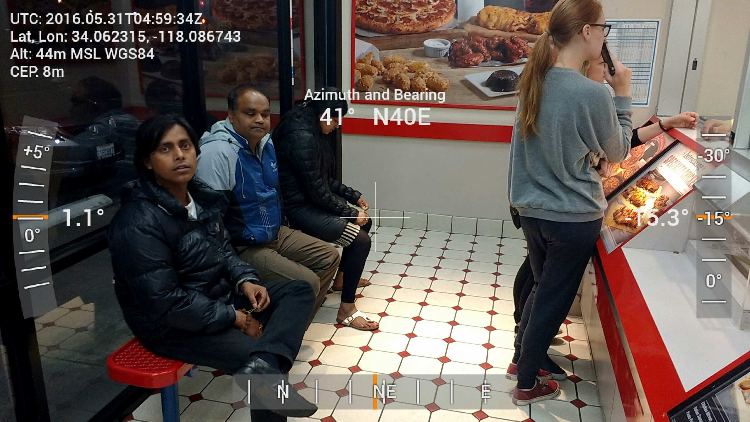 Dioptra GPS / XYZ Compass image of people ordering at a Dominoes Pizza window